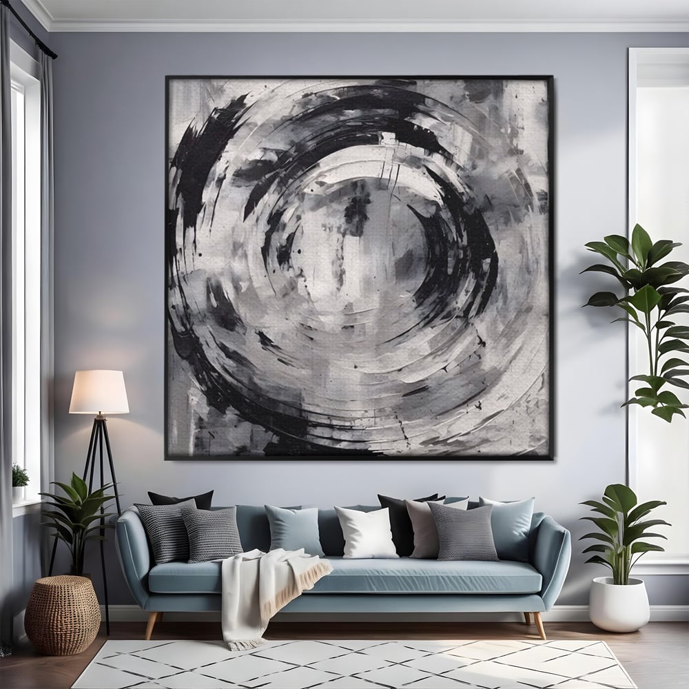 Tablou canvas cu tablou canvas cu cerc abstract, in rama de aluminiu negru, pe perete intr-un living